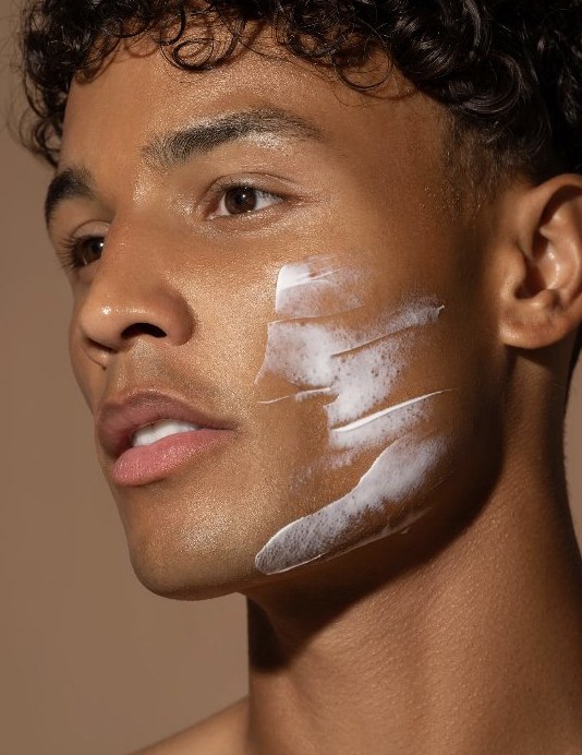 Moisturiser applied across the cheek