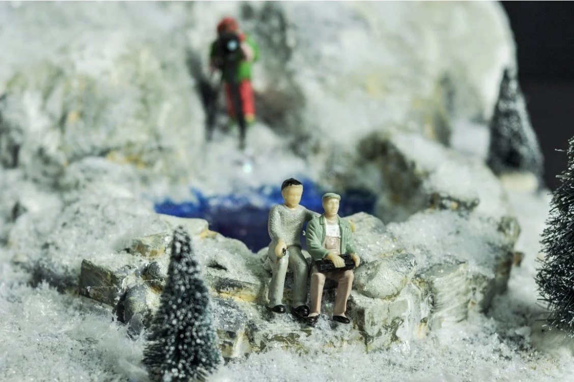 Miniature figures on a snowy model landscape