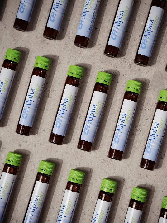 Rows of CH-Alpha Sport vials on concrete