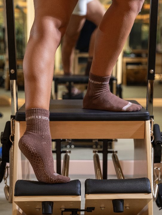 Krump grip socks on a Pilates chair
