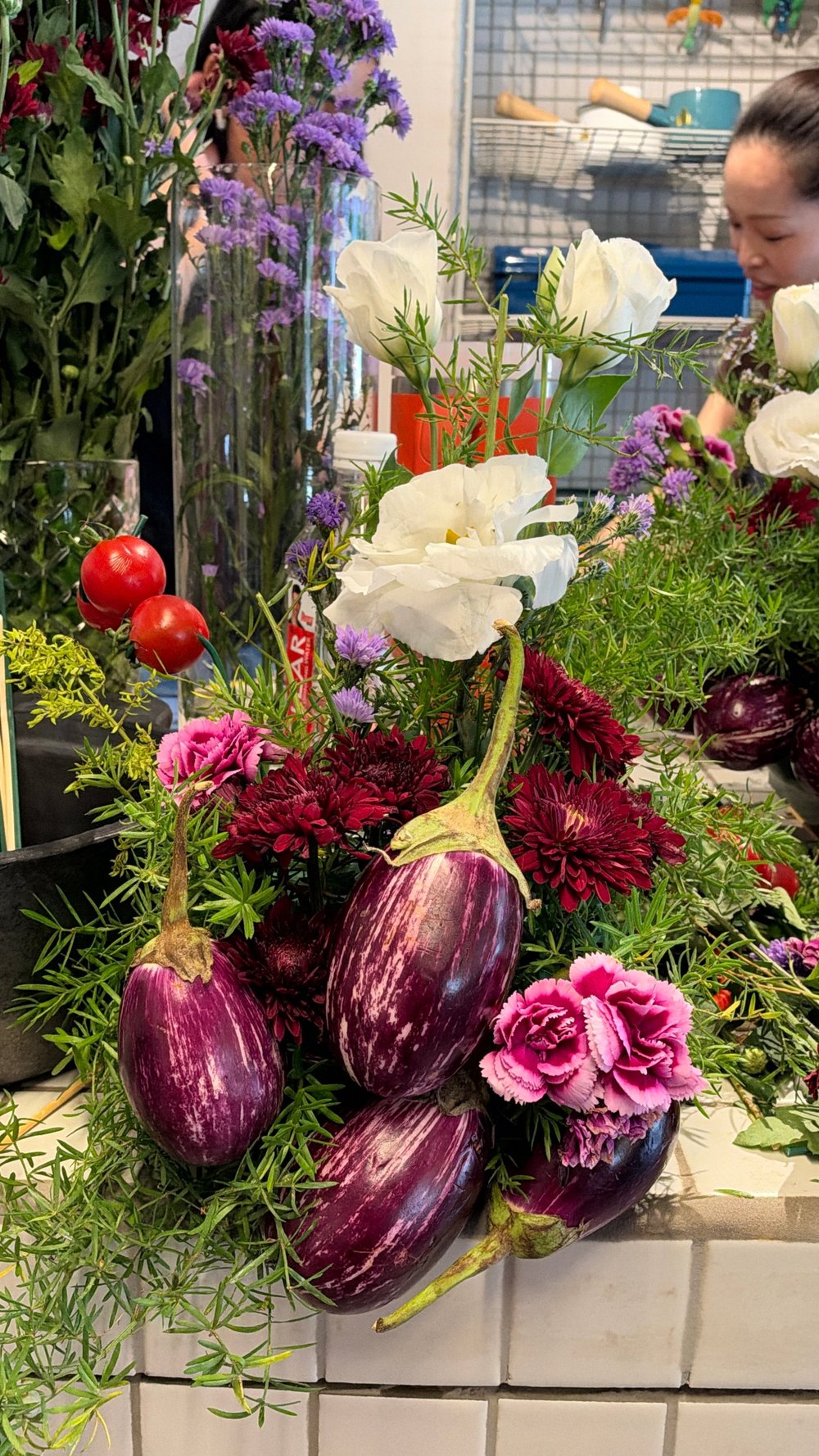 Aubergine and flower arrangement