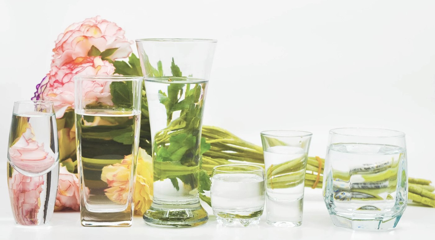 Flowers refracted through glasses of water