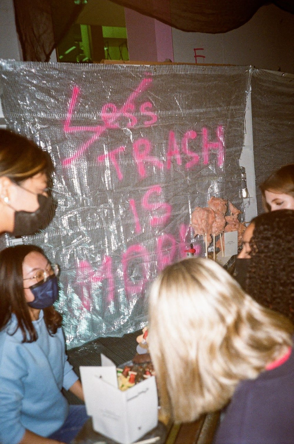 Film photo: Less trash is more banner at an event